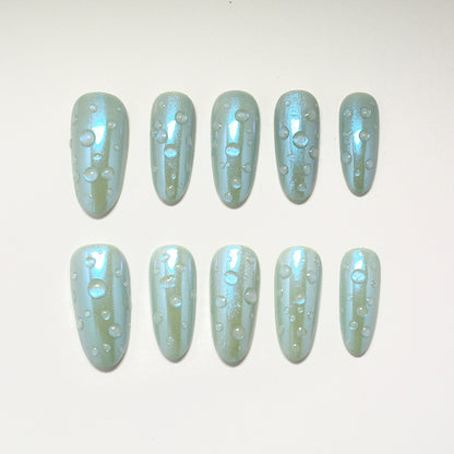Set of light blue nail polish with glitter on a white background
